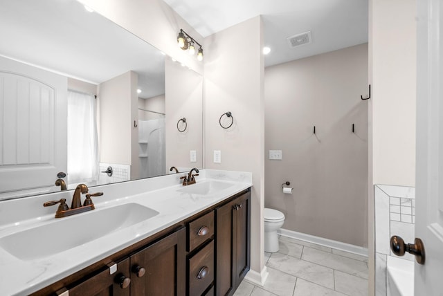 805 Waldon Ct, Clarksville, TN 37042 - bathroom with toilet, marble look tile flooring, double vanity, baseboards, and a shower