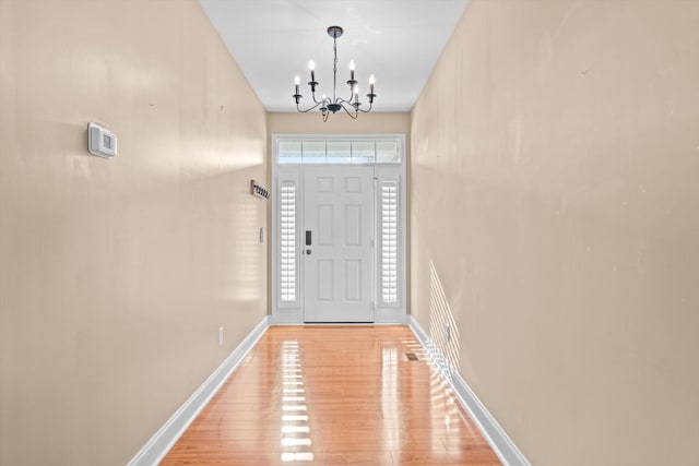 3337 Tarsus Rd, Palmyra, TN 37142 - entryway with a chandelier and light wood-style floors