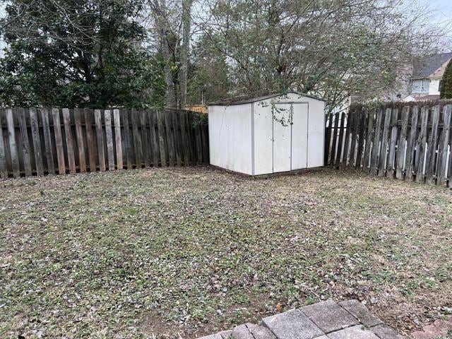 view of shed with a fenced backyard