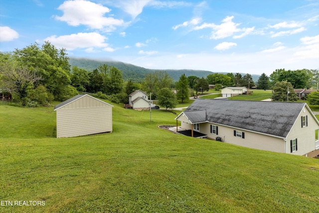 122 Springfield Ln, Jacksboro, TN 37757 - view of green lawn featuring a shed and an outdoor structure