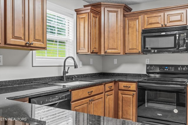 122 Springfield Ln, Jacksboro, TN 37757 - kitchen with black appliances, a sink, and brown cabinets