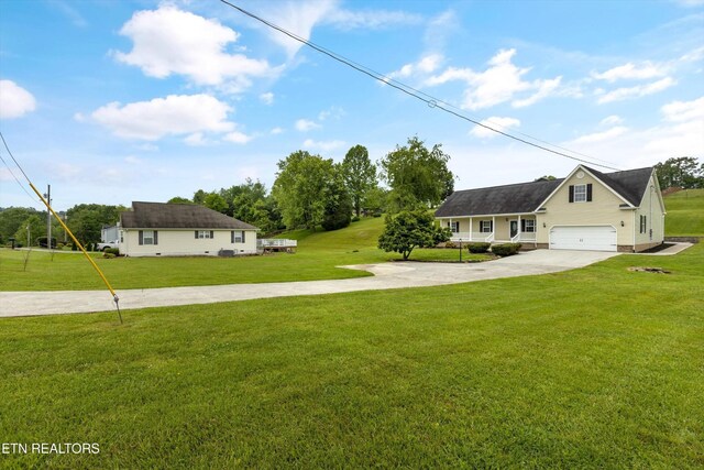 122 Springfield Ln, Jacksboro, TN 37757 - view of front of house with concrete driveway and a front lawn