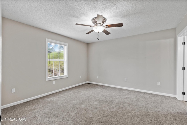 122 Springfield Ln, Jacksboro, TN 37757 - spare room featuring ceiling fan, a textured ceiling, carpet flooring, and baseboards
