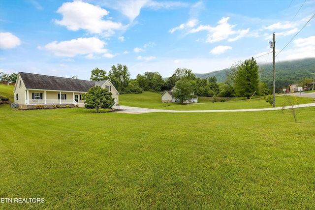 122 Springfield Ln, Jacksboro, TN 37757 - surrounding community featuring a lawn, concrete driveway, and a mountain view