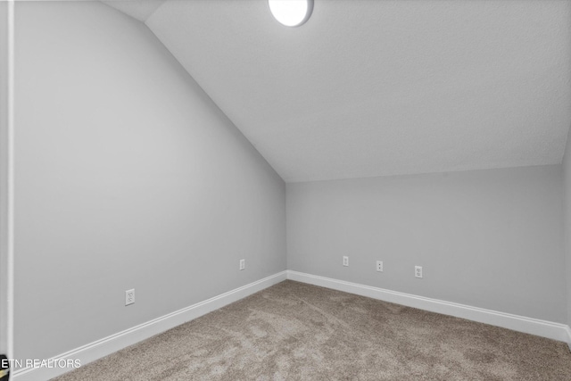 122 Springfield Ln, Jacksboro, TN 37757 - additional living space with lofted ceiling, carpet, and baseboards