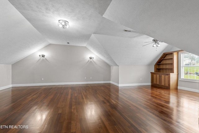 122 Springfield Ln, Jacksboro, TN 37757 - bonus room with a textured ceiling, dark wood finished floors, lofted ceiling, baseboards, and built in features