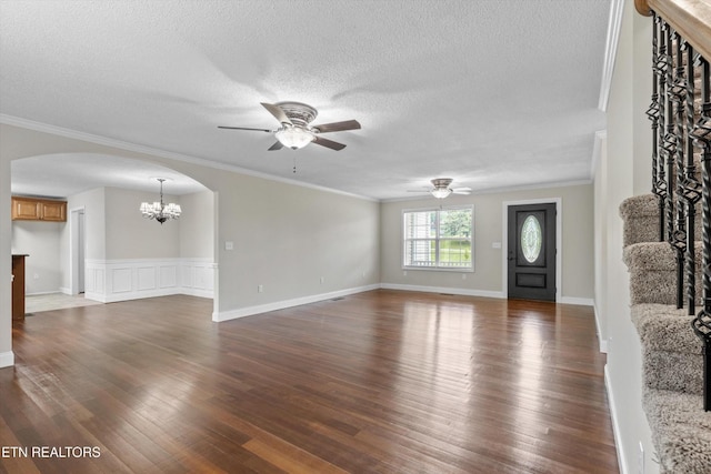 122 Springfield Ln, Jacksboro, TN 37757 - unfurnished living room with arched walkways, a ceiling fan, a chandelier, dark wood-style flooring, and a textured ceiling