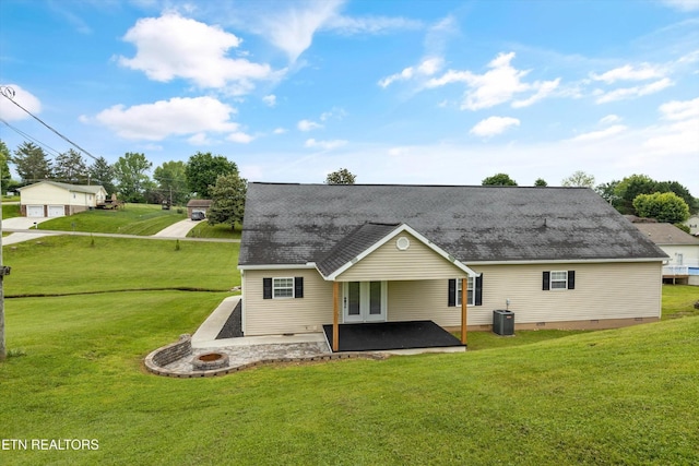 122 Springfield Ln, Jacksboro, TN 37757 - rear view of house with a patio area, a lawn, a shingled roof, crawl space, and central AC unit