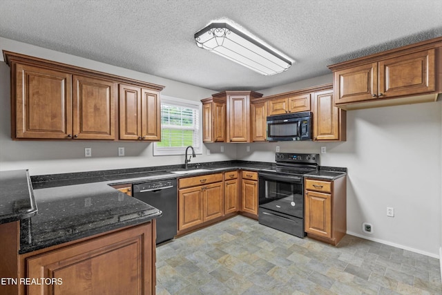 122 Springfield Ln, Jacksboro, TN 37757 - kitchen featuring black appliances, a sink, brown cabinets, dark stone countertops, and a textured ceiling