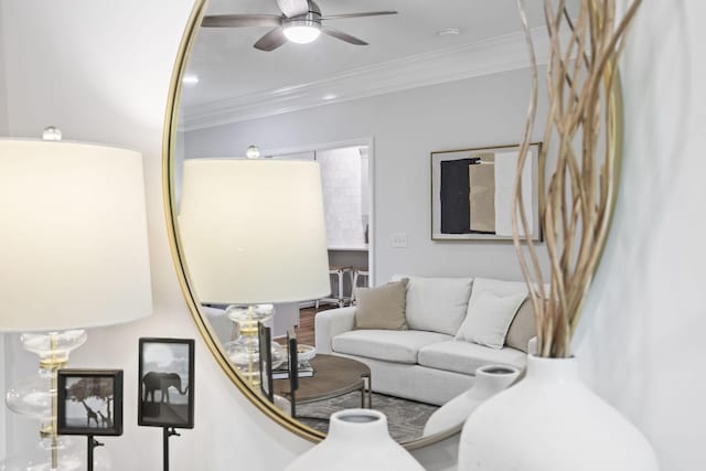 1183 Buckingham Cir, Franklin, TN 37064 - living area with crown molding and a ceiling fan