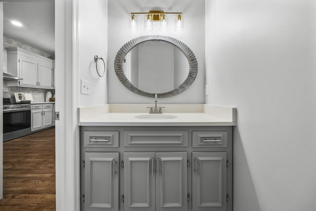 1183 Buckingham Cir, Franklin, TN 37064 - bathroom with wood finished floors, tasteful backsplash, and vanity