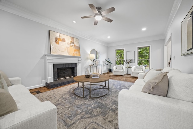 1183 Buckingham Cir, Franklin, TN 37064 - living area with wood finished floors, a fireplace, ceiling fan, recessed lighting, and ornamental molding