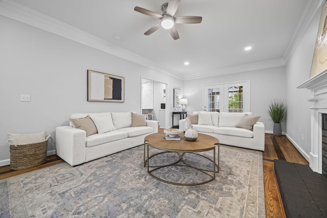 1183 Buckingham Cir, Franklin, TN 37064 - living area with wood finished floors, a ceiling fan, a fireplace, baseboards, and crown molding