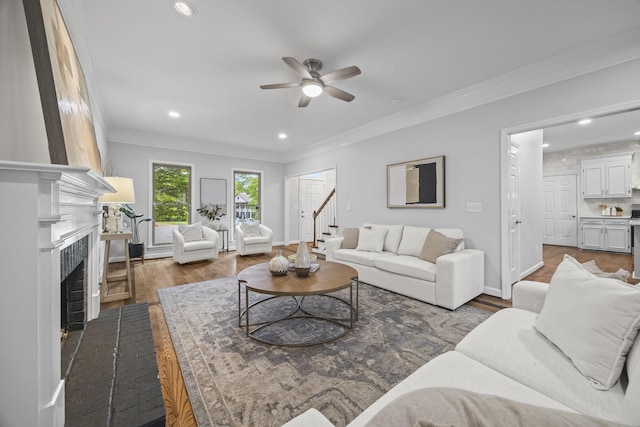 1183 Buckingham Cir, Franklin, TN 37064 - living area featuring crown molding, ceiling fan, dark wood finished floors, recessed lighting, and baseboards