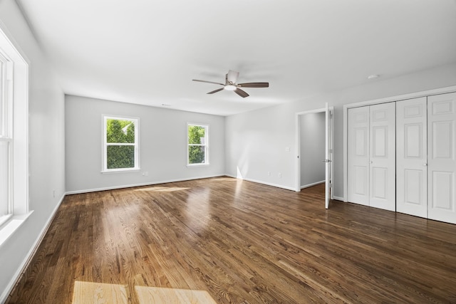 1183 Buckingham Cir, Franklin, TN 37064 - unfurnished bedroom featuring dark wood-style flooring, baseboards, ceiling fan, and a closet