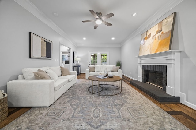 1183 Buckingham Cir, Franklin, TN 37064 - living area featuring ceiling fan, a brick fireplace, wood finished floors, crown molding, and recessed lighting
