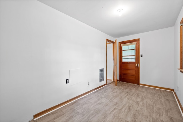 spare room featuring baseboards