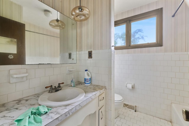1023 Pine Valley Rd, Kingston Springs, TN 37082 - bathroom featuring tile walls, vanity, toilet, a tub to relax in, and wallpapered walls