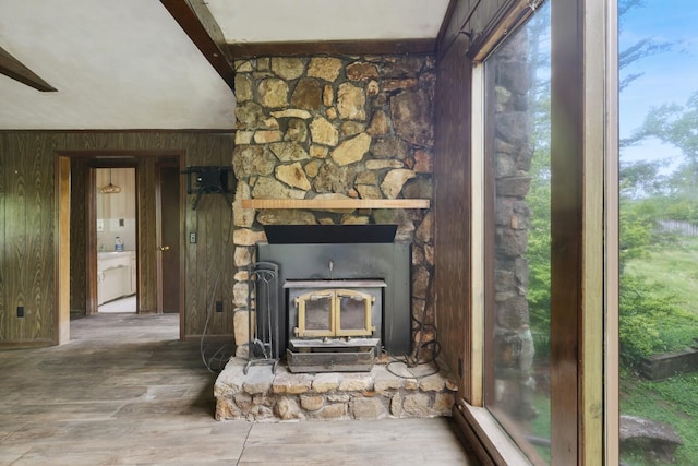 1023 Pine Valley Rd, Kingston Springs, TN 37082 - detailed view of wooden walls, wood finished floors, and a wood stove