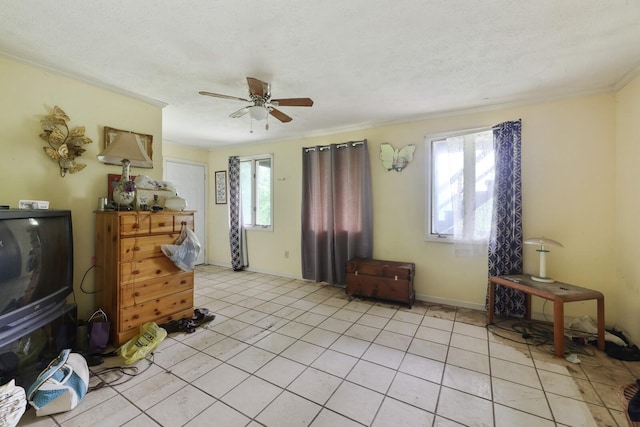 1023 Pine Valley Rd, Kingston Springs, TN 37082 - living room featuring ceiling fan, light tile patterned floors, ornamental molding, and baseboards