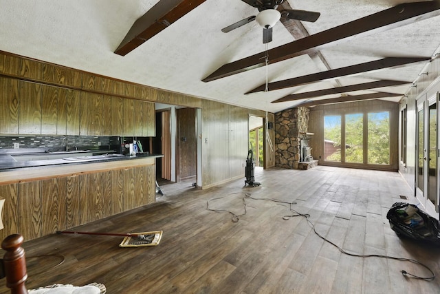 1023 Pine Valley Rd, Kingston Springs, TN 37082 - unfurnished living room with hardwood / wood-style flooring, ceiling fan, a sink, and wooden walls