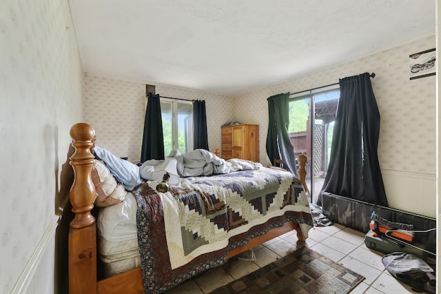 1023 Pine Valley Rd, Kingston Springs, TN 37082 - tiled bedroom featuring wallpapered walls and a wainscoted wall
