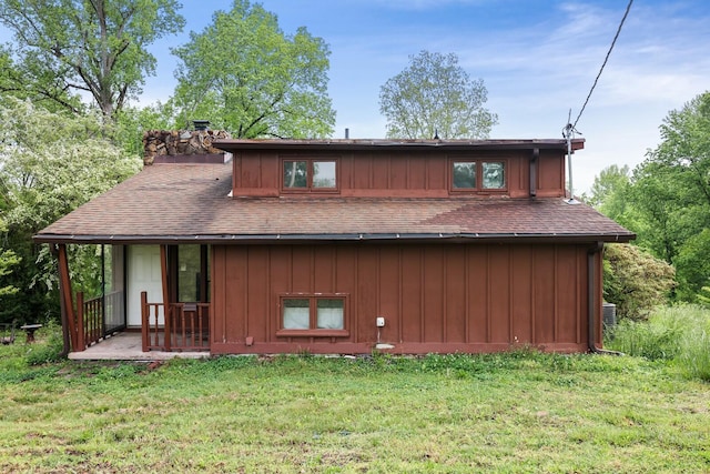 1023 Pine Valley Rd, Kingston Springs, TN 37082 - rear view of house featuring a lawn, a chimney, covered porch, and a shingled roof