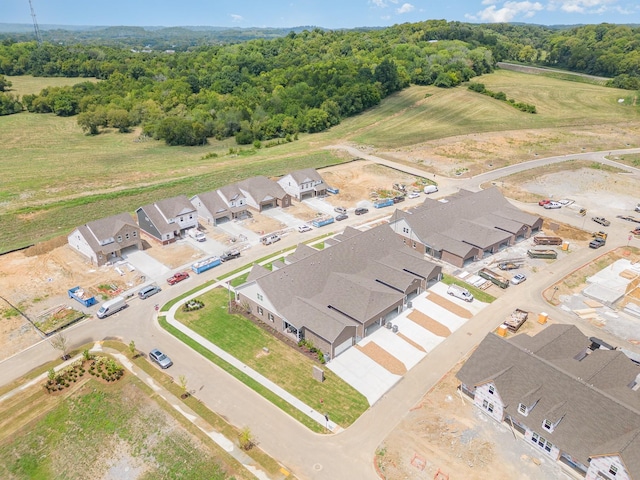 aerial perspective of suburban area featuring a forest