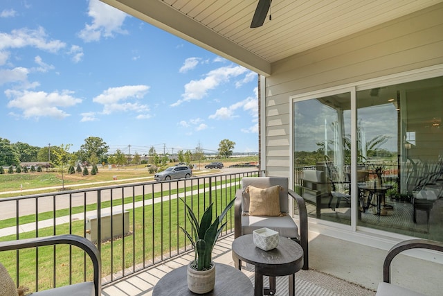 balcony featuring a ceiling fan