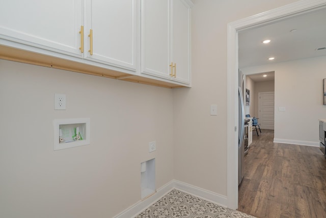 clothes washing area with cabinet space, washer hookup, baseboards, recessed lighting, and wood finished floors