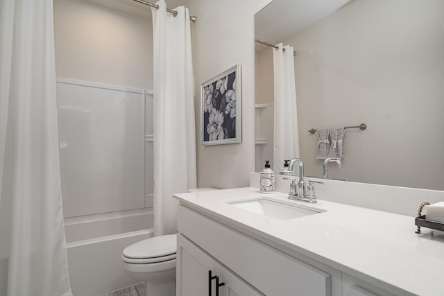 full bath with toilet, vanity, and shower / tub combo with curtain