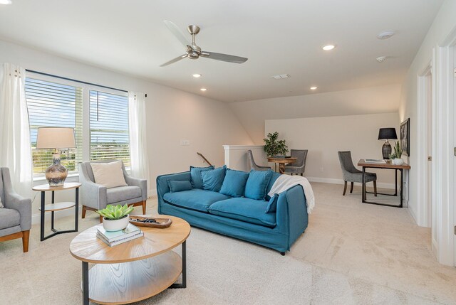living room with a ceiling fan, light carpet, baseboards, and recessed lighting