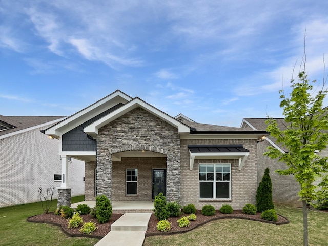 6332 York Dr, Hermitage, TN 37076 - craftsman inspired home featuring a front yard, stone siding, brick siding, and covered porch