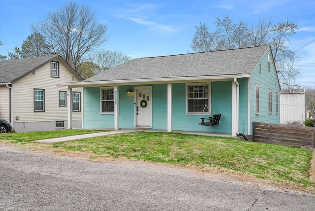 view of front of property featuring roof with shingles and covered porch