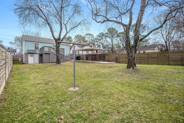 view of yard featuring stairway and a wooden deck