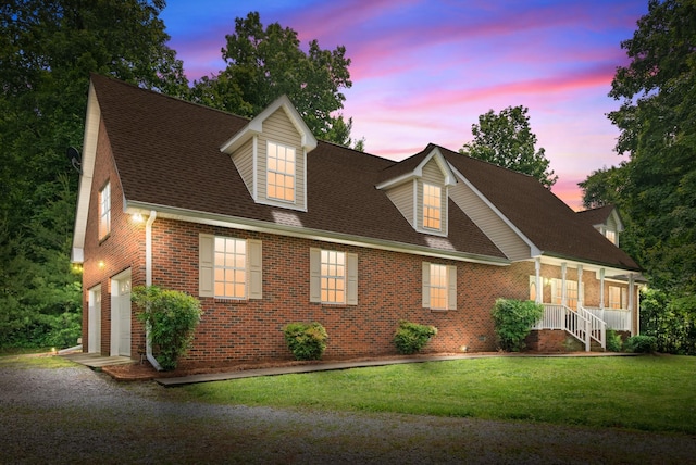 5643 Bethlehem Rd, Springfield, TN 37172 - cape cod house with brick siding, driveway, a garage, a front yard, and a shingled roof