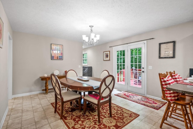5643 Bethlehem Rd, Springfield, TN 37172 - dining room featuring a chandelier, baseboards, a textured ceiling, and light floors