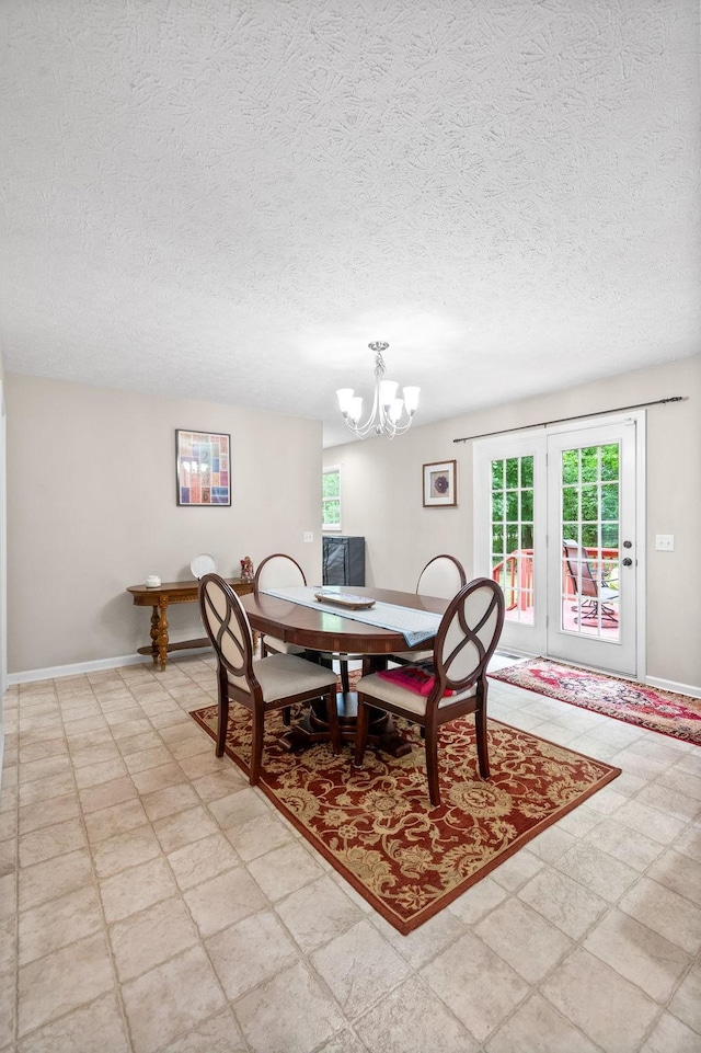 5643 Bethlehem Rd, Springfield, TN 37172 - dining space with a chandelier, a textured ceiling, baseboards, and light flooring