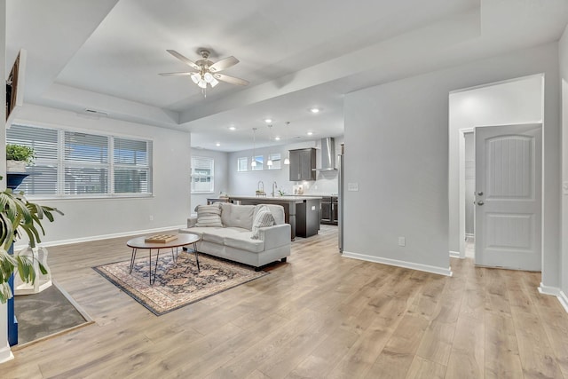 1044 Alta Vista Ln, Smyrna, TN 37167 - living area with a raised ceiling, ceiling fan, baseboards, light wood finished floors, and recessed lighting