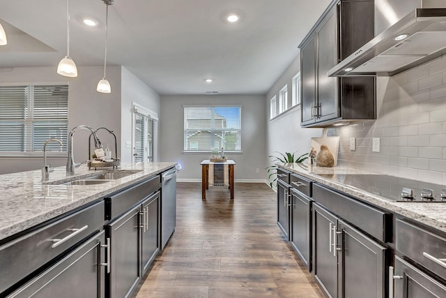 1044 Alta Vista Ln, Smyrna, TN 37167 - kitchen featuring wall chimney range hood, a sink, stainless steel dishwasher, dark wood finished floors, and decorative backsplash
