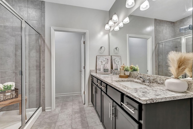 1044 Alta Vista Ln, Smyrna, TN 37167 - bathroom with double vanity, a shower stall, tile patterned flooring, and baseboards