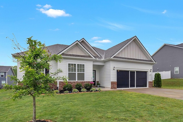 1044 Alta Vista Ln, Smyrna, TN 37167 - view of front of property with board and batten siding, brick siding, concrete driveway, a front lawn, and an attached garage