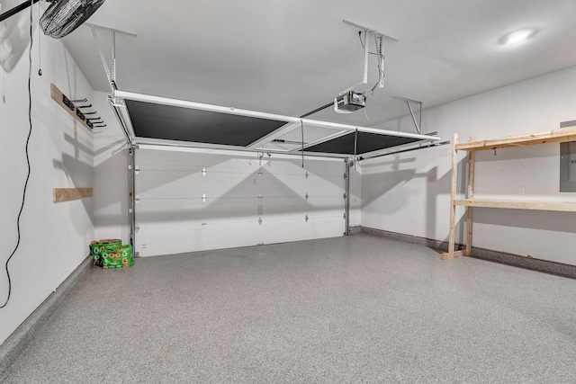 1044 Alta Vista Ln, Smyrna, TN 37167 - garage featuring baseboards, a garage door opener, and electric panel