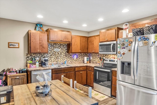 587 Mason Everette Rd, Belvidere, TN 37306 - kitchen with stainless steel appliances, a sink, light countertops, backsplash, and recessed lighting
