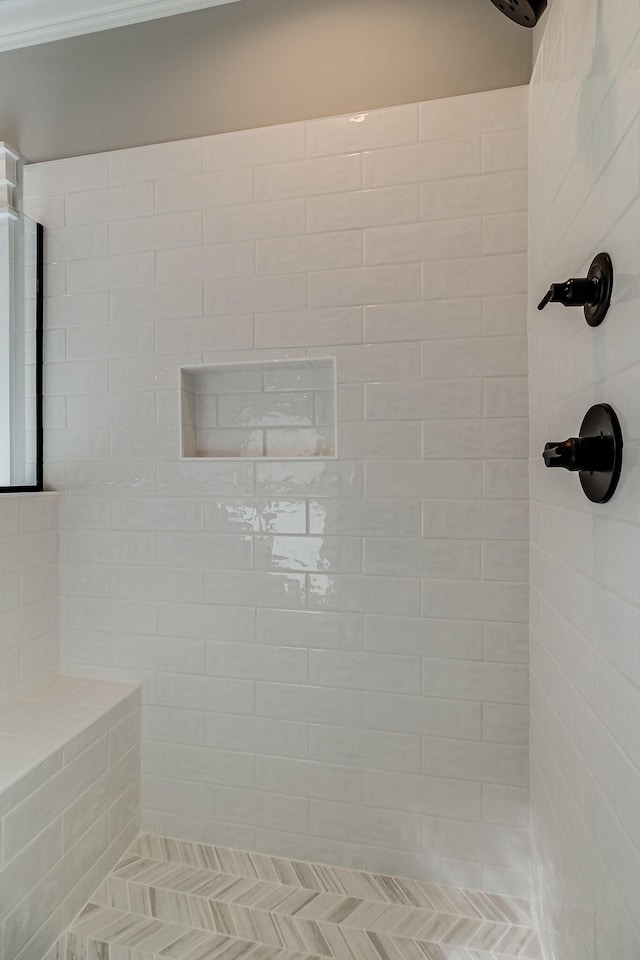 bathroom with a tile shower