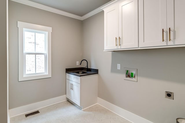 laundry room featuring hookup for an electric dryer, cabinet space, baseboards, ornamental molding, and hookup for a washing machine