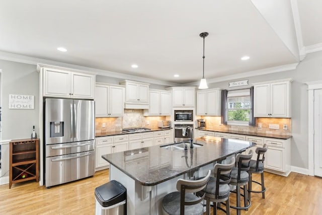 1384 Round Hill Ln, Spring Hill, TN 37174 - kitchen featuring appliances with stainless steel finishes, a sink, ornamental molding, white cabinetry, and decorative backsplash