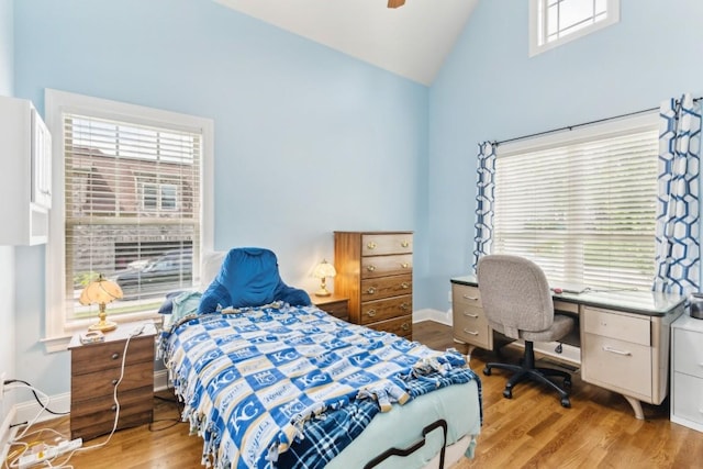 1384 Round Hill Ln, Spring Hill, TN 37174 - bedroom with high vaulted ceiling, wood finished floors, multiple windows, a ceiling fan, and an office area