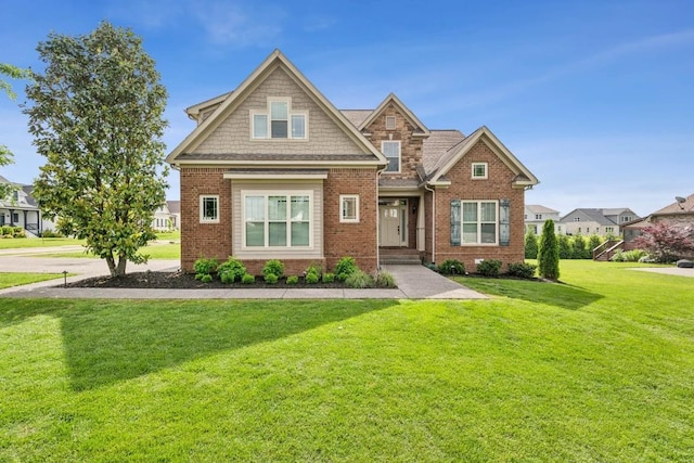 1384 Round Hill Ln, Spring Hill, TN 37174 - craftsman-style home with a front yard and brick siding