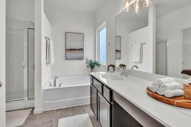 bathroom with a shower stall, a garden tub, vanity, and tile patterned floors